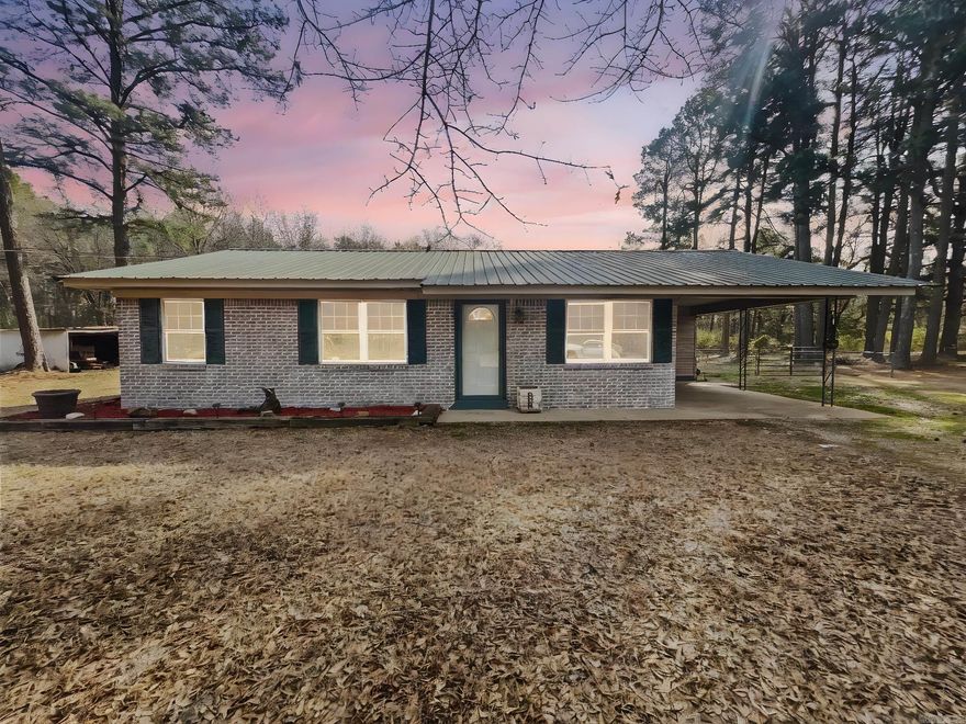 If you’ve been dreaming of a place where the pace is slower and the stars are brighter, escape to the peace and quiet of country living with this beautifully refreshed 3-bedroom, 2-bath brick home. Nestled on 3/4 of an acre with thoughtful updates throughout, this home is move-in ready! The metal roof adds durability and timeless style. The bright open living areas feel inviting and the layout makes it easy to settle in and feel at home! The office just off the primary is perfect for remote work, hobbies, or a cozy reading nook. Step outside to enjoy the covered wooden deck—a great spot for morning coffee, family barbecues, or just soaking in the fresh country air. The fenced yard has plenty of room for pets, kids, or your dream garden, and the storage building gives you extra space for tools, toys, or hobbies. The above ground pool will be perfect in the summer or could be removed prior to closing if that isn’t your preference. Stop by, slow down, relax, and welcome yourself home! Seller is motivated so come see this treasure before it’s gone!