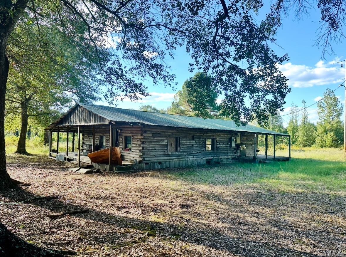 Discover 4 beautiful acres tucked away in the country, offering the perfect mix of privacy and convenience. With a cleared landscape accented by mature trees, this property is ready for your vision. It features all essential utilities already in place—including water, electricity, septic, and a storm shelter—making it an excellent foundation for your next project. A rustic cabin sits on the property in need of extensive work but holds potential for the right buyer to restore or repurpose. Easement access from Foster Chapel Rd ensures convenience while maintaining a sense of seclusion. Whether you’re dreaming of a private retreat, building your forever home, or simply enjoying peaceful land outside the city limits, this property offers incredible opportunity in a beautiful setting.