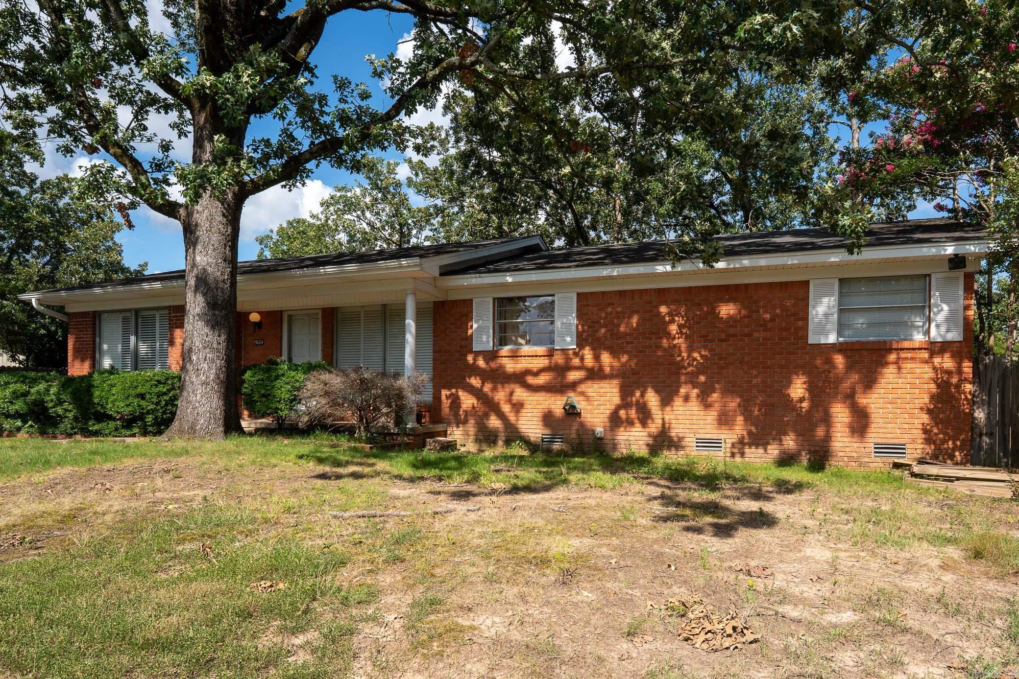 Welcome to 5104 North Cedar, located in the desirable Park Hill subdivision of North Little Rock. This beautifully updated one-level home offers 3 bedrooms, 2 full bathrooms, plus a spacious bonus area and a light-filled sunroom—providing versatile space for work, play, or relaxation. Inside, you’ll find a thoughtful blend of modern updates and original charm. The kitchen features granite countertops and tile flooring, while the bonus room and sunroom also showcase stylish tile finishes. Fresh paint throughout and original hardwood floors in the main living areas and bedrooms give the home a warm, inviting feel. The large bonus room is perfect for a second living area, home office, or media space. Enjoy your morning coffee or unwind in the cozy sunroom overlooking the backyard. Outside, there's extra parking with a carport and an additional storage area that’s ideal for a workshop or hobby space. The fenced backyard offers great outdoor potential for entertaining or relaxing. Located just minutes from downtown, shopping, schools, and parks, this move-in ready gem in Park Hill is ready for its next chapter. Don’t miss it—schedule your private showing today!
