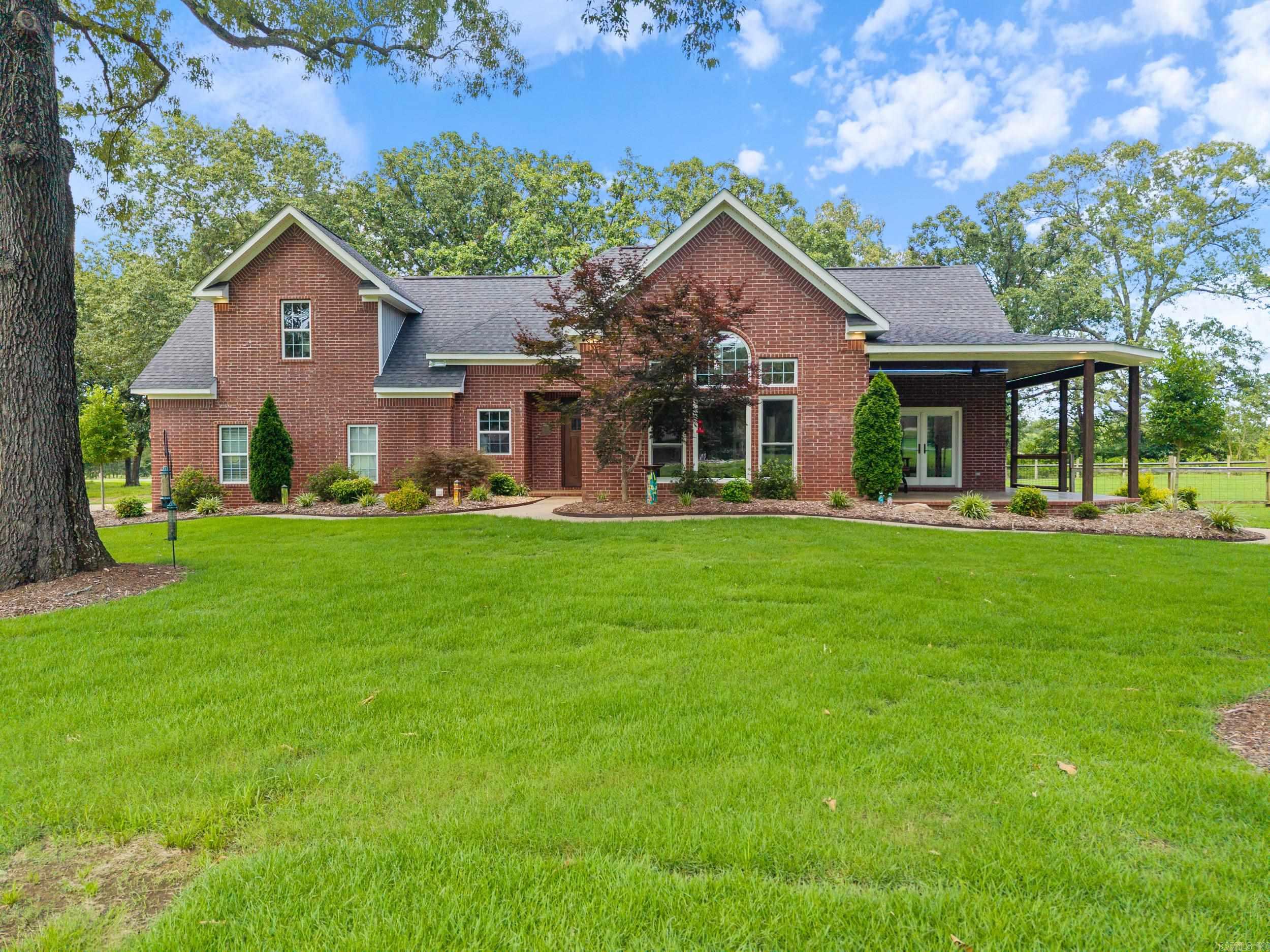Amazing home with so many expensive extras!! This home is better than new with high end finishes not found in other homes. The kitchen is a dream with granite countertops, gas range, double ovens, island, pantry, lighted cabinets AND drawers Large 3 acre lot immaculately landscaped with mature oak trees. Sprinkler system. Morton Building 18x24x9.4 fully insulated with mini split ready for install. Extra concrete for parking. Hunter Douglas automated blinds, Anderson windows in the LR, dining and kitchen. New garage doors. Roof 2020. HVAC down 2023 up 2021. Water heater 2025. LVP flooring throughout. Epoxy floors in garage. Elevated dog wash station. Room off the primary bedroom has it's own mini split. This room would make an excellent office. Don't forget the amazing porches that overlook the gorgeous yard. Refrigerator, washer dryer will convey.