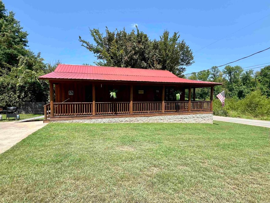 This 2-bedroom, 2-bathroom cabin is located just a short walk from the Mountain View Courthouse square, where music is being played on most weekend nights! The property has a vaulted ceiling as well as a porch around the front and side of the cabin, perfect for sitting outside and relaxing in the heart of Mountain View. The property has been used as a nightly rental property, and will come fully furnished, and could start generating income immediately. The cabin is also handicap accessible. There are lots of possibilities with this property! Call today to schedule an appointment to come take a look at it for yourself!