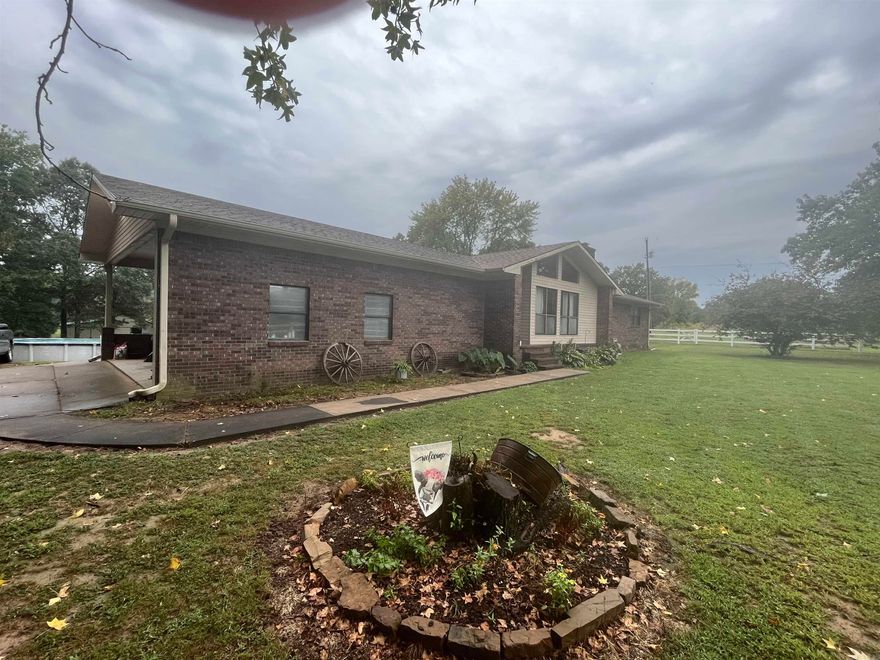 HOBBY FARM just far enough out of town for the perfect country setting! Boasting 13.24 acres more or less, 4 bedrooms, 3 bathrooms, and a horse barn/shop! Completely fenced with a pond and a wet weather creek! Want to be self sustaining? This is where you start! This comes with established fruit trees to boot! Don’t wait, call right now for your own personal showing!