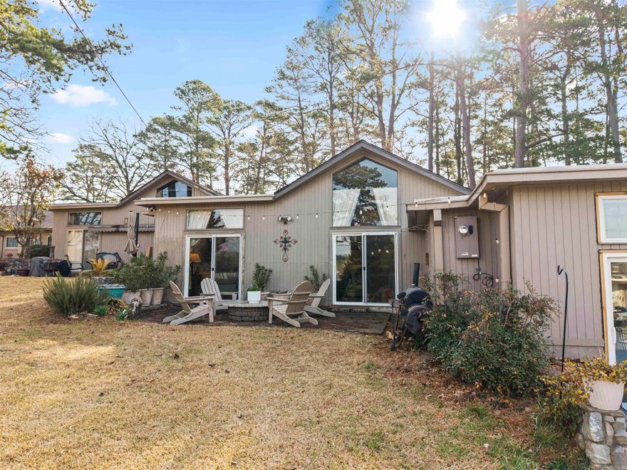 Welcome to 220 Sunset Bay Condo #29 — a beautifully situated 2 bedroom, 2 bathroom single-level condo offering comfort, convenience. With zero stairs, this ground-level unit provides easy access and effortless living.  Enjoy your morning coffee or unwind in the evening on your private back patio overlooking the beautiful lake, surrounded by mature trees that provide both shade and serenity. This unit also includes extra exterior storage, giving you added space for lake gear and personal items.  Love lake life? There is an option for yearly boat dock rental, making it easy to get out on the water whenever you like. Residents also enjoy access to the complex pool — perfect for relaxing and entertaining during the warmer months.  The monthly complex fee includes water, trash, sewage, and pool access, adding convenience and value to any lifestyle.