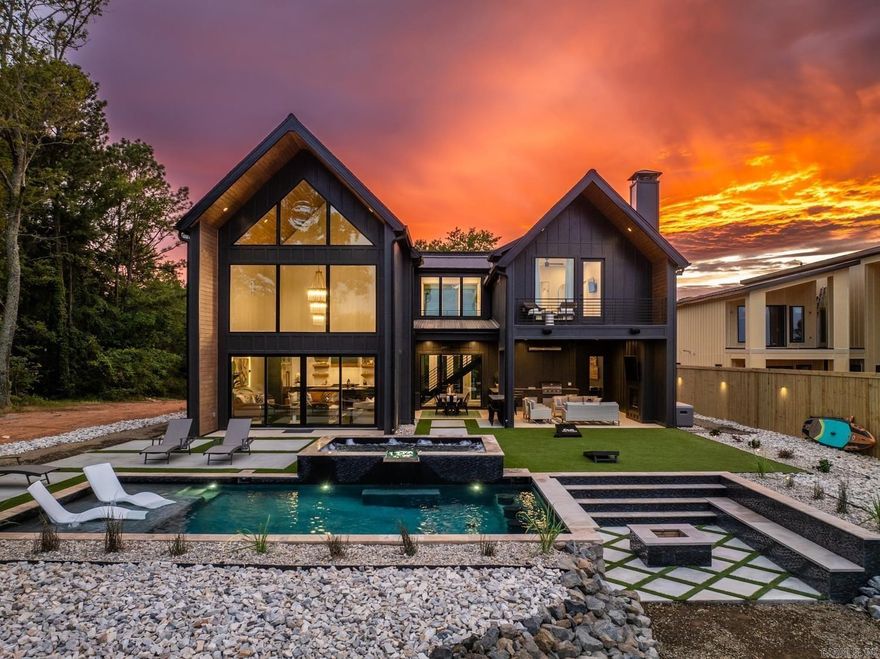 ndulge in lakeside luxury at Lake Hamilton's newest gem—an opulent 5-bedroom, 5.5-bath haven spanning 3196 sq ft. Unwind in the lavish pool, soak in the hot tub, or gather around the fire pit, all while relishing breathtaking views. This new construction masterpiece, designed for upscale nightly rentals, boasts a projected annual revenue of nearly $300,000. Inside, discover a spacious primary suite, a whimsical bunk room featuring an indoor slide, a high-end kitchen, and an inviting open floor plan—just a glimpse into the unparalleled elegance this home offers. Beyond its potential as a nightly rental, this property seamlessly transforms into an idyllic family lake home or a luxurious primary residence. Its blend of elegance and contemporary design provides the perfect backdrop for creating lasting memories and enjoying the tranquility of lakefront living. Whether for entertaining guests or relishing quiet family moments, this home effortlessly adapts to a variety of lifestyles, making it a versatile and captivating space for those seeking a residence with both style and comfort.