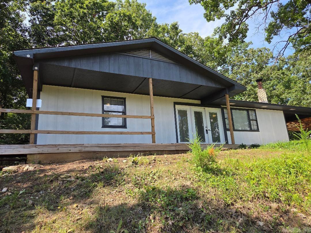 Welcome to this beautifully renovated 2 bedroom, 1 bath home sitting on a full acre m/l just outside the heart of Yellville. Perched on a peaceful hillside, you'll enjoy stunning views of town right from your back deck-the perfect spot for mourning coffee or evening sunsets. Step inside to find a fresh and stylish kitchen featuring beautiful countertops and plenty of space for meal prep and entertaining. The spacious living room offers cozy comfort with a wood insert fireplace, making it a warm and inviting place to relax year-round. Outside, you've got room to roam-a full acre m/l with no restrictions, perfect for a garden or even a few chickens! Enjoy the best of both worlds: peaceful country living just minutes from town.