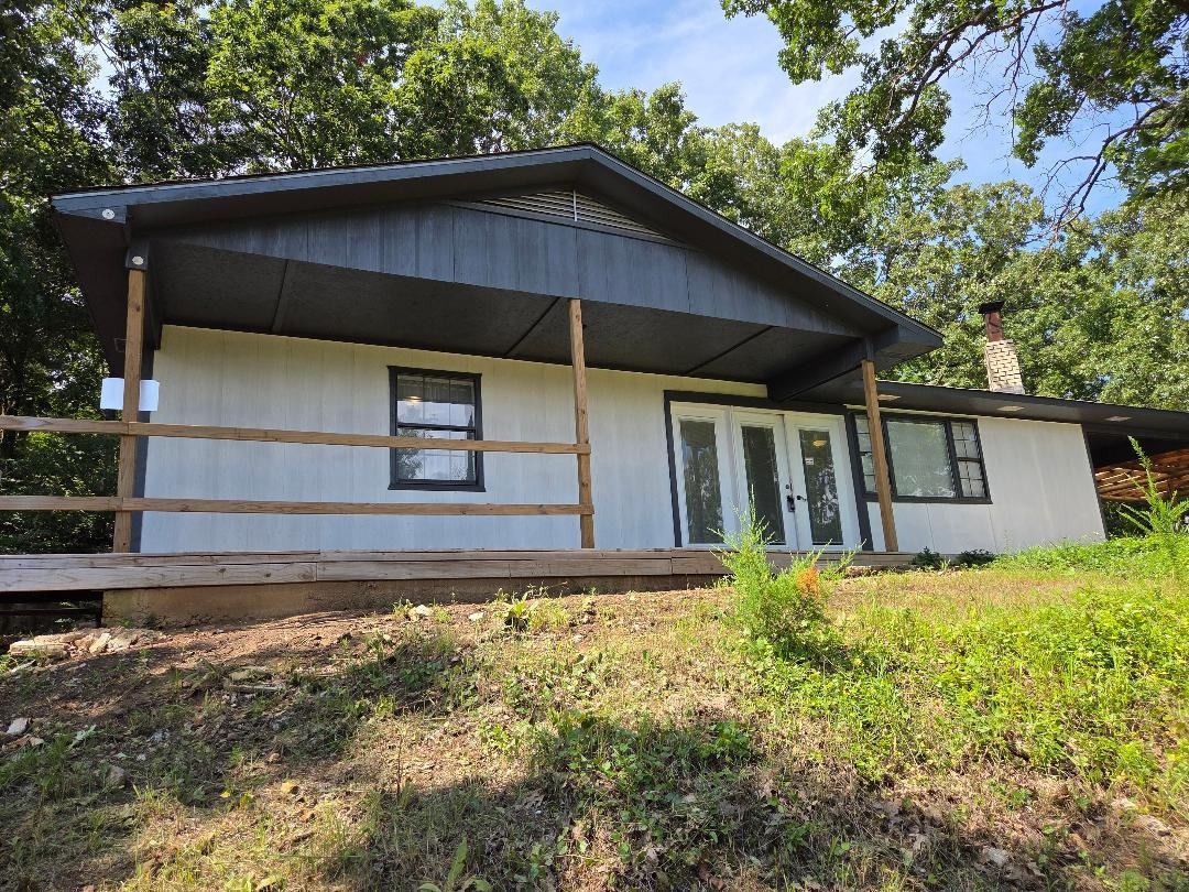 Welcome to this beautifully renovated 2 bedroom, 1 bath home sitting on a full acre m/l just outside the heart of Yellville. Perched on a peaceful hillside, you'll enjoy stunning views of town right from your back deck-the perfect spot for mourning coffee or evening sunsets. Step inside to find a fresh and stylish kitchen featuring beautiful countertops and plenty of space for meal prep and entertaining. The spacious living room offers cozy comfort with a wood insert fireplace, making it a warm and inviting place to relax year-round. Outside, you've got room to roam-a full acre m/l with no restrictions, perfect for a garden or even a few chickens! Enjoy the best of both worlds: peaceful country living just minutes from town.
