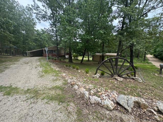 LOCATION..LOCATIONā¦LOCATION.. This spacious home is located minutes from town but sitting on nearly one and a half acres m/l with no restrictions! Also, located not far from the Famous Spring River! Inside you will find three bedrooms, a spacious living room and a basement with a large family room with fireplace! Outside you will a wrap around deck that overlooks the property. This amazing home is waiting for you to come take a look! Buyer to verify all information about property.