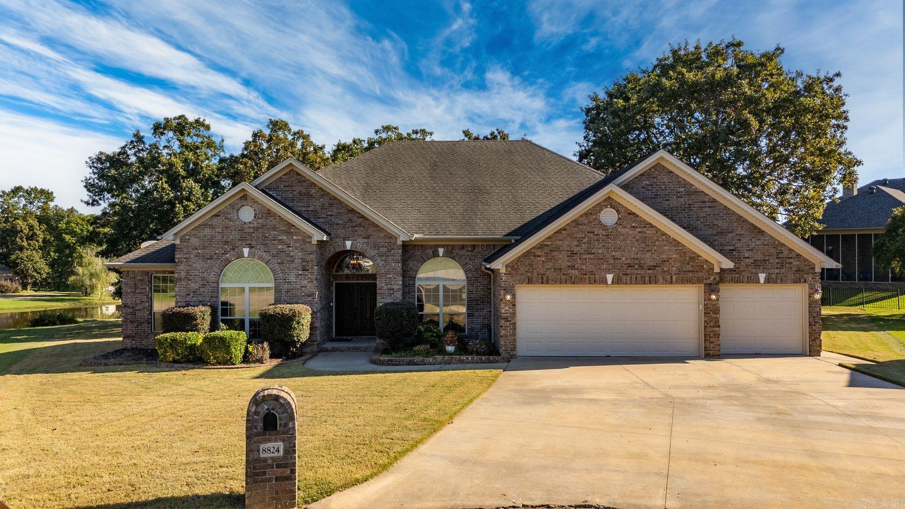 Welcome to 8824 Ridgeview Cove! A beautiful brick home nestled in a quiet cul-de-sac in one of Sherwood’s most desirable neighborhoods. This spacious 3-bedroom, 2.5-bath residence offers 2,748 square feet of comfortable living space, plus a dedicated office perfect for remote work or a study area. Built in 2006, the home features a split-bedroom floor plan, high ceilings, and plenty of natural light throughout. The open-concept kitchen flows into the living area, ideal for entertaining guests or enjoying family time. The large primary suite includes a spa-like bath with double vanities, a soaking tub, separate shower, and a generous walk-in closet. The expansive screened-in back porch overlooking the neighborhood waterfront view is fabulous living space! Situated on just over half an acre, the backyard offers ample space for gardening, outdoor activities, or adding a future pool. A 3-car garage provides plenty of storage and parking. Floored attic above garage. Located minutes from shopping and dining, this home truly has it all!