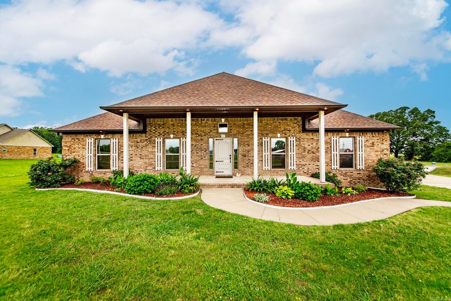 Meticulously maintained home on 3 acres surrounded by a peaceful country setting. Front Porch Charm & gorgeous landscaping greets you as you step into the formal entry way. Home features high ceilings, lots of natural light & beautifully stained concrete floors. Kitchen has tons of cabinet space, granite countertops, SS appl, large pantry, breakfast bar & seamless view into the living room w/fireplace adding warmth & coziness. Crown molding & uplighting provide an elegant touch. Formal dining room or flex space.  Home offers a split floor plan that ensures privacy, w/primary suite serving as a true retreat. It features soaker tub, a standup shower, a double vanity, private water closet & walk in closet. Utility room is oversized & accessible from mult areas including master closet. Sit on the front porch & enjoy view of horses just across the street! Green space behind! Storm shelter just steps from back door, oversized 800 sq foot detached garage, luxury chicken coop (ventilation doors, exhaust fans & automatic doors) add'l shop w/electric! Home has ground mounted Solar ~easy for maintenance that will be paid off at closing w/acceptable offer. Close to Conway~back gate of LRAFB!