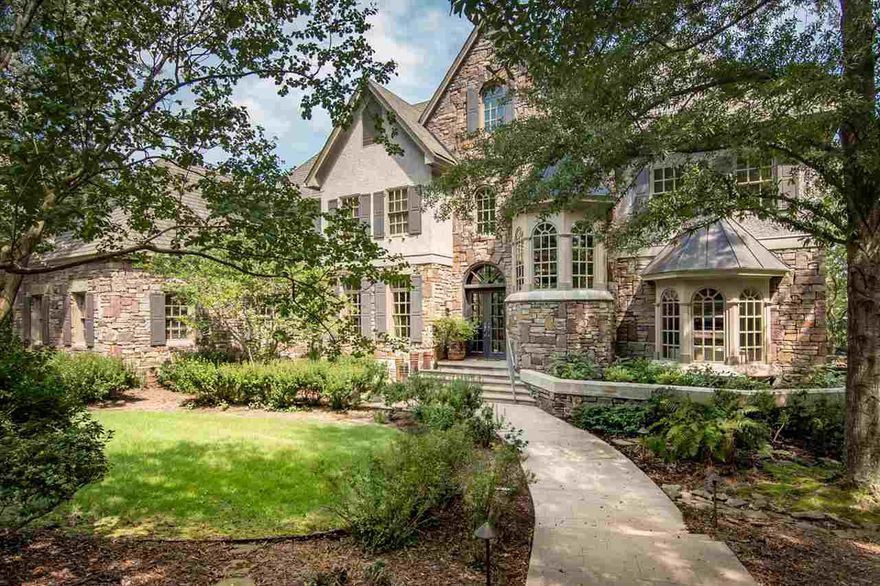 Architecturally designed, this stunning custom built home in gated Carmel is sited on .87 acres in the heart of west LR.  Beautifully crafted windows, 10 ft ceilings, 9 ft made to order interior doors, site finished floors, & handsome paint finishes characterize this home. The European kitchen features a copper sink, Viking 5 burner gas range & double ovens, built in fridge. Hearth room w/huge windows looking out on a pool, patio & lush landscaping. Multiple outdoor living spaces. Elevator. Superb quality.