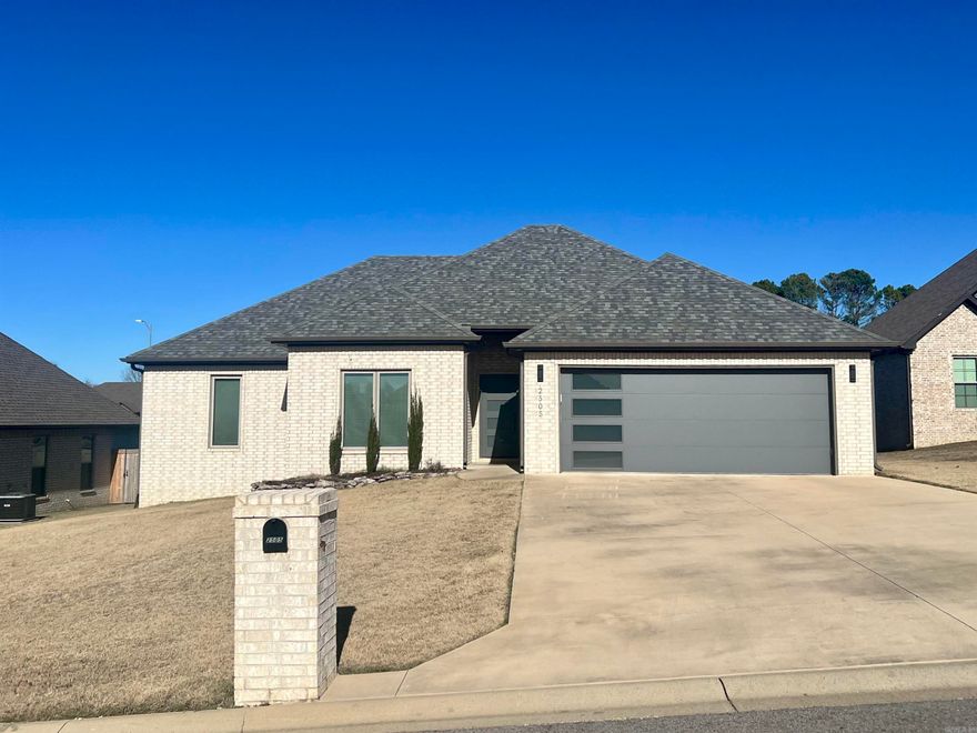 Welcome to 2505 Dallas Drive — a beautifully designed all-brick home offering modern style, quality finishes, and a functional open floor plan. This 3-bedroom, 2-bath property features luxury wood-style vinyl plank flooring throughout, providing durability and a clean, cohesive look. The living area is bright and inviting with a cozy fireplace that serves as a warm focal point. The kitchen is equipped with granite countertops, stainless steel appliances, abundant cabinetry, and a pantry for added storage. Its open layout connects seamlessly to the living area, making it ideal for both everyday living and entertaining. The large primary bedroom offers comfort and privacy, while the primary bath includes dual vanities with granite countertops, a relaxing soaker tub, a walk-in shower, and a spacious walk-in closet. Outside, the fenced backyard provides room to relax or play, complete with a covered back porch and an additional patio area perfect for outdoor gatherings. Located in a desirable Paragould neighborhood, this home blends modern design with practical features, making it an excellent choice for those seeking comfort and style.