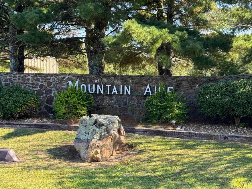 Excellent 2-acre building lot in Mountain Aire Subdivision. Seller has a 4 Bedroom Septic System Permit for a standard system. There is a wet weather stream on the East side of the lot. Build your home and enjoy the added bonus of fishing the subdivision's private 27-acre Lake Moore.