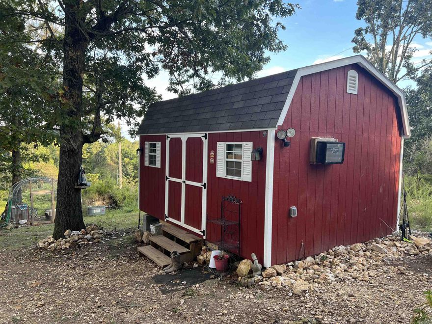 Are you looking for a spot to build a home, park a RV, or place a mobile? This 9.79 Acres M/L property may work for you. The property has a 12ft x 16ft storage building cabin, rural water meter and faucet, electric meter, and septic in place. No Restrictions. The land is mostly in woods and has a great level spot for a home. Come check it out today.