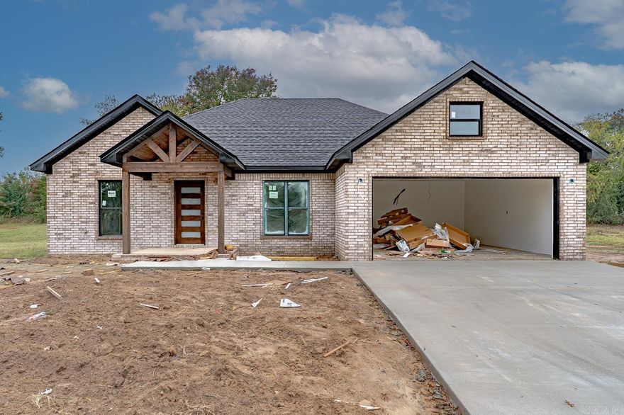 Welcome to Market 223 Woodland Trail in Bono, AR!  This beautiful home combines modern new construction style with timeless elegance. Inside, you'll find a custom walk-in shower, stunning Cambria stone countertops that add a touch of luxury, and vaulted ceilings that create a spacious feel. The kitchen features a gas stove, and the home includes a gas water heater, electric fireplace, and beautiful cabinetry throughout. Enjoy relaxing or entertaining on the covered back patio. This one is a true beauty.  Schedule your showing today!  Home will be completed soon. **More pics coming soon