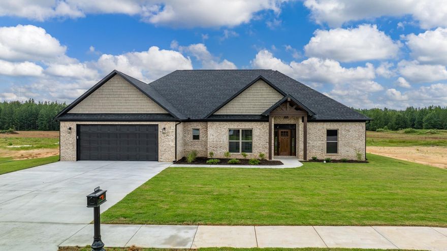 You dont want to miss this one!!! This house boasts all the details you could ever dream of! Walk into the extremely open and split floor plan with a coffered ceiling in the large living room! The kitchen boasts quartz counter tops and oversized custom cabinets to the ceiling, along with a large pantry with cabinets inside it as well! On the primary suite side, you'll find a huge primary bath with split his and her vanities (and a seated makeup station on her side) and a MASSIVE closet that connects to the equally huge laundry room that has tons of cabinetry as well! You will also find a half bath in the hallway that is easily accessibility for your guests. The back porch is HUGE and perfect for entertaining! This home also features a tankless water heater with re-circ system, solar board decking and spray foam insulation for increased efficiency! Also featuring soffit/eave lighting, gas range and utilities, and so much more! Make sure to schedule your showing today!