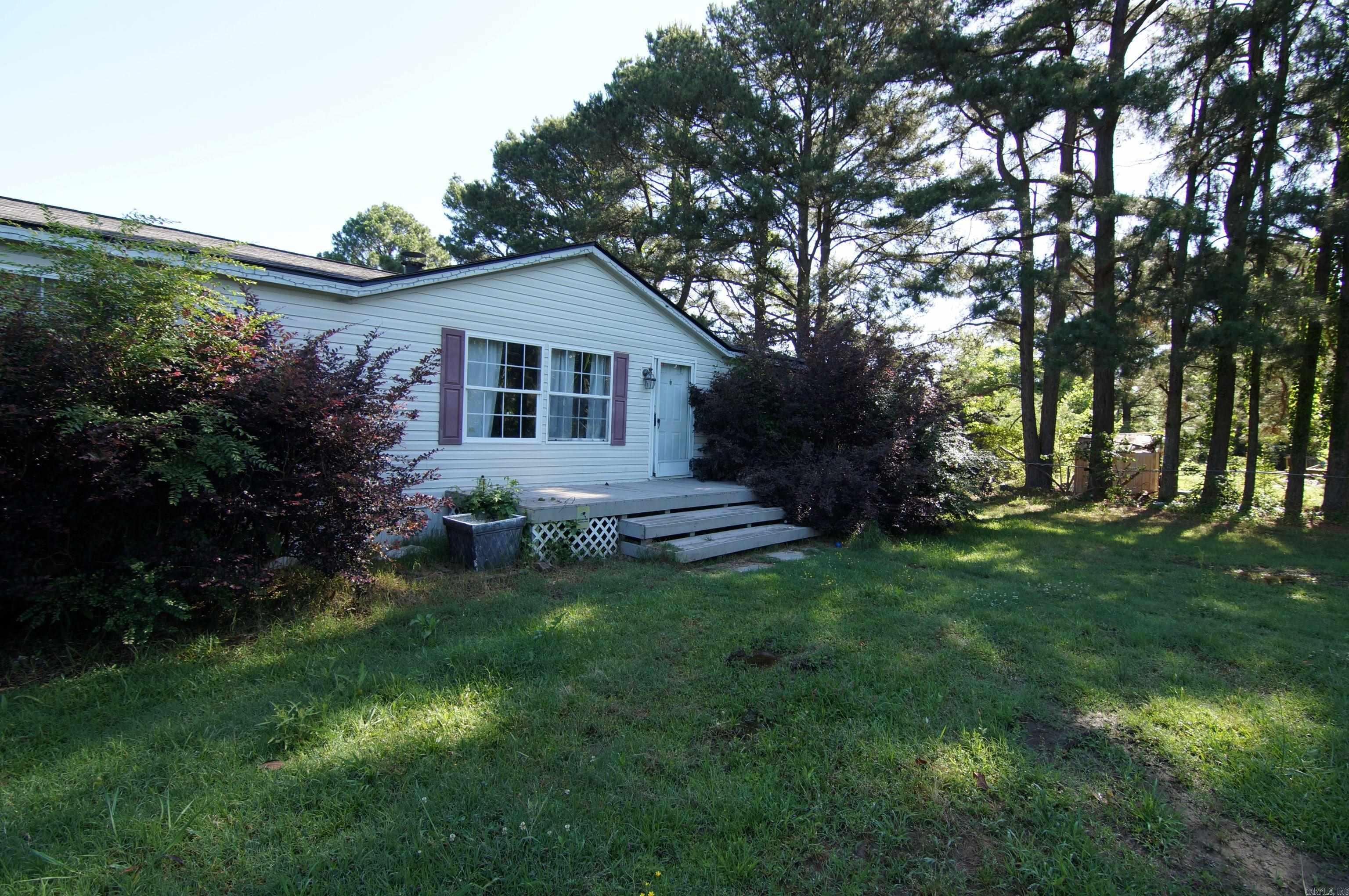 A great opportunity to own your own home. This property needs some TLC but can be a beautiful property once again. The more expensive items have been done for you. The roof is new and the HVAC is only about 2 years old. The home offers a split floor plan with a large primary suite that has a soaking tub and stand up shower. A nice sized dining and kitchen area is great for friends and family get togethers. A wood burning fireplace will keep you cozy through the cold months and adds focal point to the living room. Summers can be enjoyed outside on this 1.6 acre lot with a 28 x 16 covered deck. See this one today.