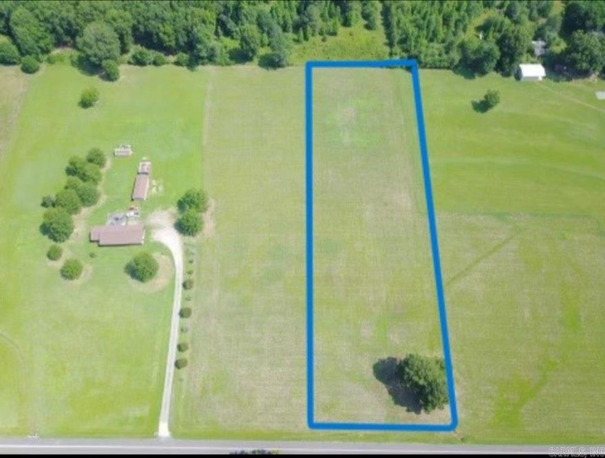 Take a look at this cleared and level lot outside the city limits on 2.58 acres. This property has already been perc tested and surveyed. No mobile homes allowed. Drive on out and take a look. Utilities and water at the road.
