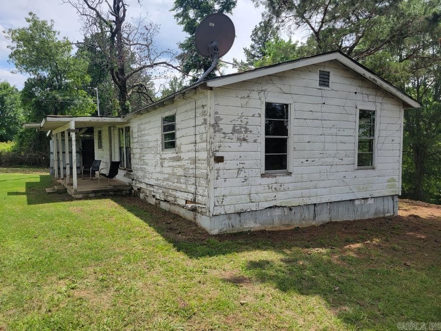 Beautiful, Beautiful 1 acre lot with very old home. Possibly a good carpenter could restore the structure. Listing price determined by lot value only. SOLD AS IS.