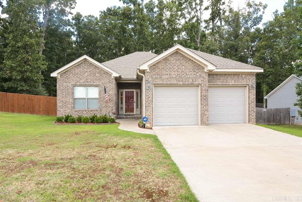 Open floorplan home w/ all the extras. Features include: granite counters throughout, wide plank laminate wood floors, spacious bedrooms, gas fireplace, updated paint, architectural shingle roof, gutters. Master bath has his & hers closets, his & hers separate sink vanities, separate whirlpool tub accented in granite. The backyard is privacy fenced w/greenspace. Part of yard left in its natural state so you can enjoy the best of both, cleared manicured yard and partially wooded w/ stonepath & wood bridge.