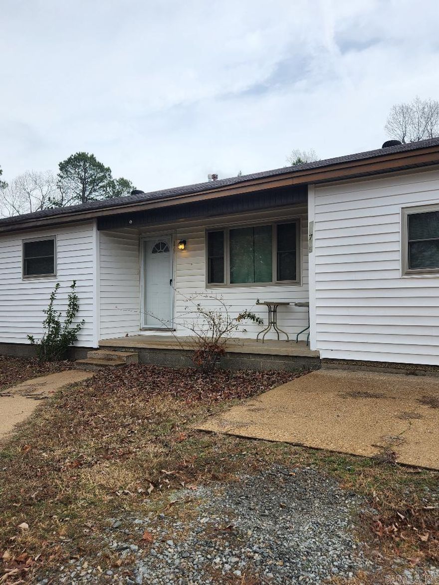 Motivated seller!  House sold As Is.  Plenty of land to spread out on with small workshop and storage building in back.  Great for investor or someone looking for starter home with a little work.