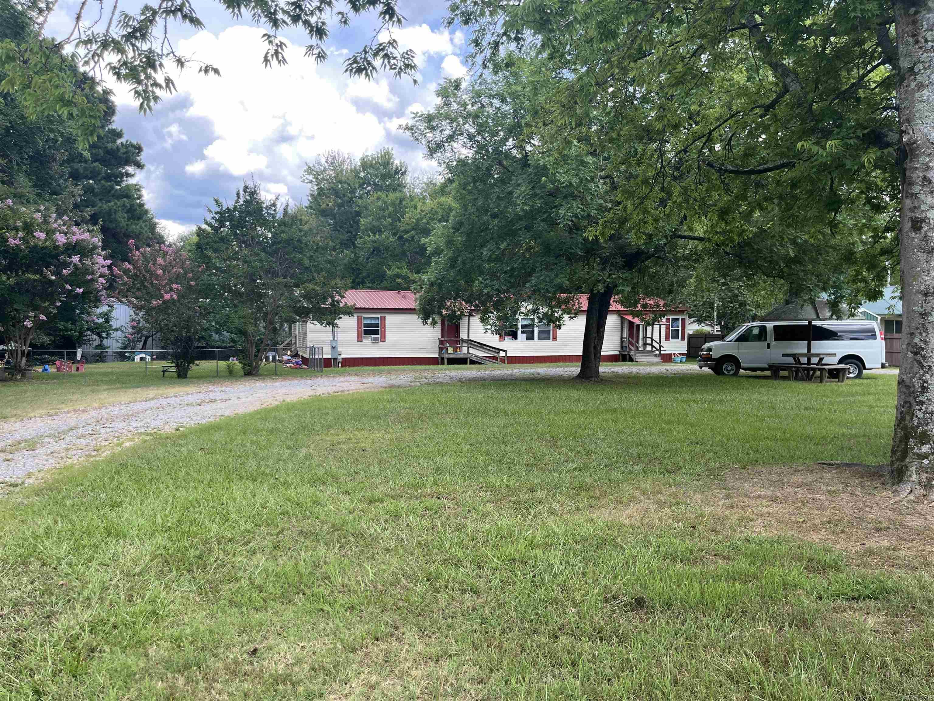 Great opportunity to own a larger home on huge 3/4 acre lot in the heart of Haskell. This property has been used as a day care center for 20 years and has had some modifications made to suit the needs of a day care. But, someone with some handyman skills can easily return it to a functional residential property. This property is half a block from Harmony Grove School. It is zoned Town Center Mix (residential and commercial uses) which means that the property will only increase in value as time goes by.