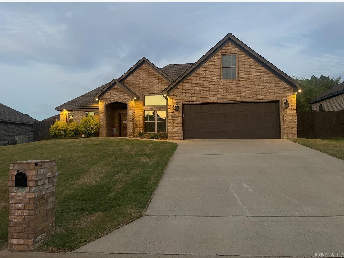 This one is a show stopper! Beautiful inside and out. Gorgeous flooring, very open floor plan with a huge living room plus dining or sitting room and a breakfast bar in this beautiful kitchen. Pretty granite countertops, stainless appliances and tons of cabinets in the kitchen. The laundry room has lots of cabinets for more storage. So many windows in this house for lots of natural light plus beautiful blinds so you can decide to let the light in or keep the blinds closed. The primary bedroom is great size and has a beautiful en suite bathroom with a soaking tub and a beautiful new custom tile shower. Granite countertops and double sinks in this pretty vanity and a huge walk in closet. The main bathroom also has a granite countertop vanity and tub shower unit and is conveniently located off the kitchen and also close to the other 3 bedrooms which are all good size rooms and all have great closet space. The privacy fenced back yard has a covered back patio with tons of room for outside entertaining. Sellers had new gutters installed along with a new mini split heat and air unit for the 4th bedroom.