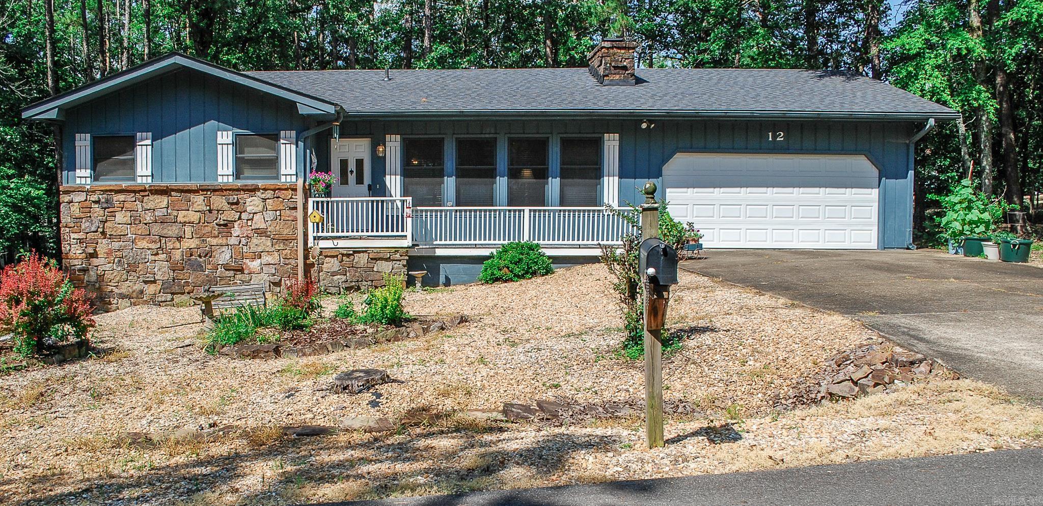 Easy living in this 2 bedroom 1.5 bath home. Carport was converted to double garage, new roof installed 2023, level lot borders common property adjoining the back yard. Galley kitchen opens to living area. Native stone fireplace. Convenient locale to Hwy 7 amenities. Hot Springs Village Property Owner Association has a new member buy-in fee of $2,000.00 due and collected at closing. Photos to be taken at a later time.