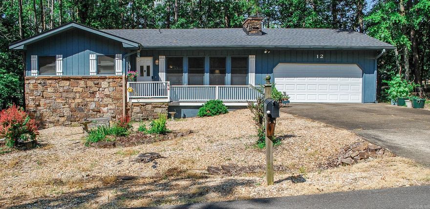 Easy living in this 2 bedroom 1.5 bath home. Carport was converted to double garage, new roof installed 2023, level lot borders common property adjoining the back yard. Galley kitchen opens to living area. Native stone fireplace. Convenient locale to Hwy 7 amenities. Hot Springs Village Property Owner Association has a new member buy-in fee of $2,000.00 due and collected at closing. Photos to be taken at a later time.