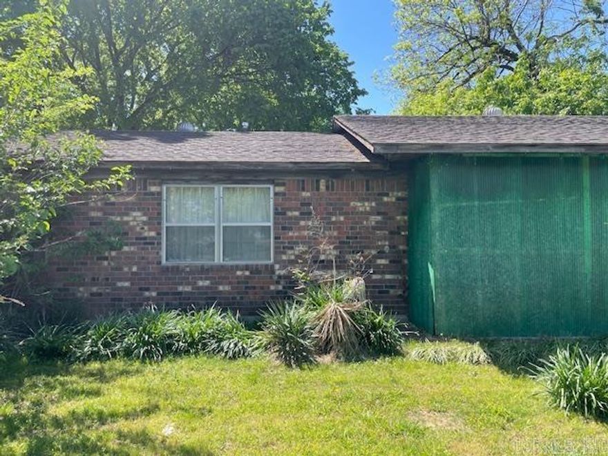 A great investment house.  The house being sold as is.  The house contains 3 bedrooms and 1.5 bath, a partially chain length fence in back.  2 car driveway and 1 car carport .  A fixer upper and across from the park tennis courts.