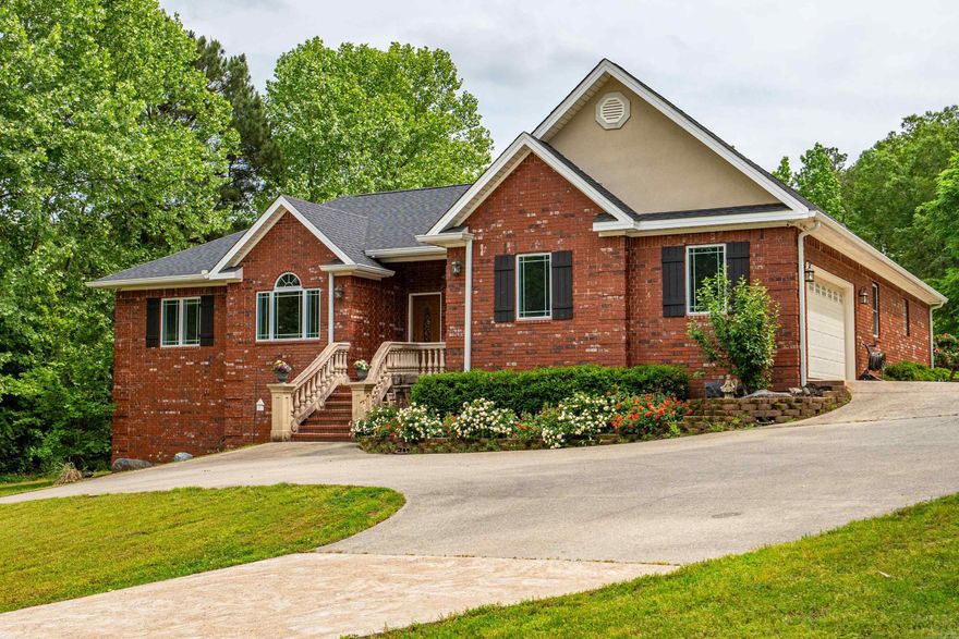 Nearly 3,000 Sq Ft Brick Home on 1.71 Acres with Private HOA Lake Access! Welcome to this stunning 4-bedroom, 3.5-bath brick home offering 2962 square feet of beautiful living space, all set on a picturesque 1.71-acre lot. Located in Lake Hamilton School District, this property includes private HOA (Fee only $50/year) lake access with a dock, pier, and boat ramp — ideal for boating, fishing, swimming, and enjoying the outdoors. Inside, the home features real hardwood floors, a wood-burning fireplace, and a thoughtfully designed layout with a large office, formal dining room, and chef-style kitchen with granite countertops and double oven. Additional interior highlights include a closed-circuit security camera system, whole-house central vacuum, and updated roofing and gutters (2024). The fully finished walkout basement is a showstopper, boasting heated flooring, a media room with projector and surround sound, and a full bathroom — perfect for a guest suite or entertainment space. Outside, you’ll find an attached two-car garage with a full staircase leading to a floored attic, as well as a detached two-car garage with a lean-to for extra storage.