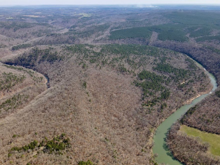 Opportunities like this are truly one-of-a-kind. This exceptional property features nearly a mile of frontage on the Devils Fork of the Little Red River, offering a rare combination of deep water, cascading rapids, and crystal-clear pools ideal for fishing, swimming, and year-round water recreation. The land itself lies beautifully, with a gentle, usable topography and a stunning stand of large mature timber that creates a natural, park-like setting. Access to the property is currently via a well-established private woods road used by neighboring landowners; however, there is no deeded legal access, making this a unique opportunity for buyers seeking a long-term recreational investment or willing to secure access.  This is a true raw land offering with no utilities currently available, appealing to those seeking an off-grid retreat or a future development opportunity. Mineral rights owned by the seller may be conveyed, adding further value to this already rare tract.  Whether you envision a private riverfront getaway, a legacy recreational property, or a long-term investment in highly desirable Little Red River frontage, this property delivers unmatched natural beauty and scarcity.