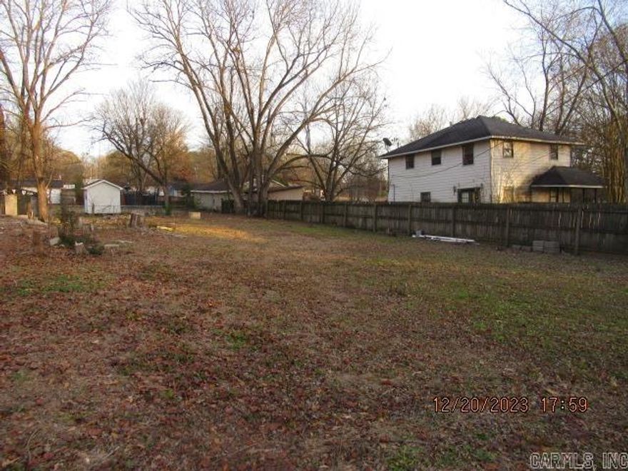 Lot has been cleared but till has some tree stumps; Owner has no information of Lot; Dimensions are 73x74x160 approx; Trailers have been previously allowed and grandfathered in; Any trailer at the present would have to go through City of Bryant to get approved; Utilities at street; Lot would require septic