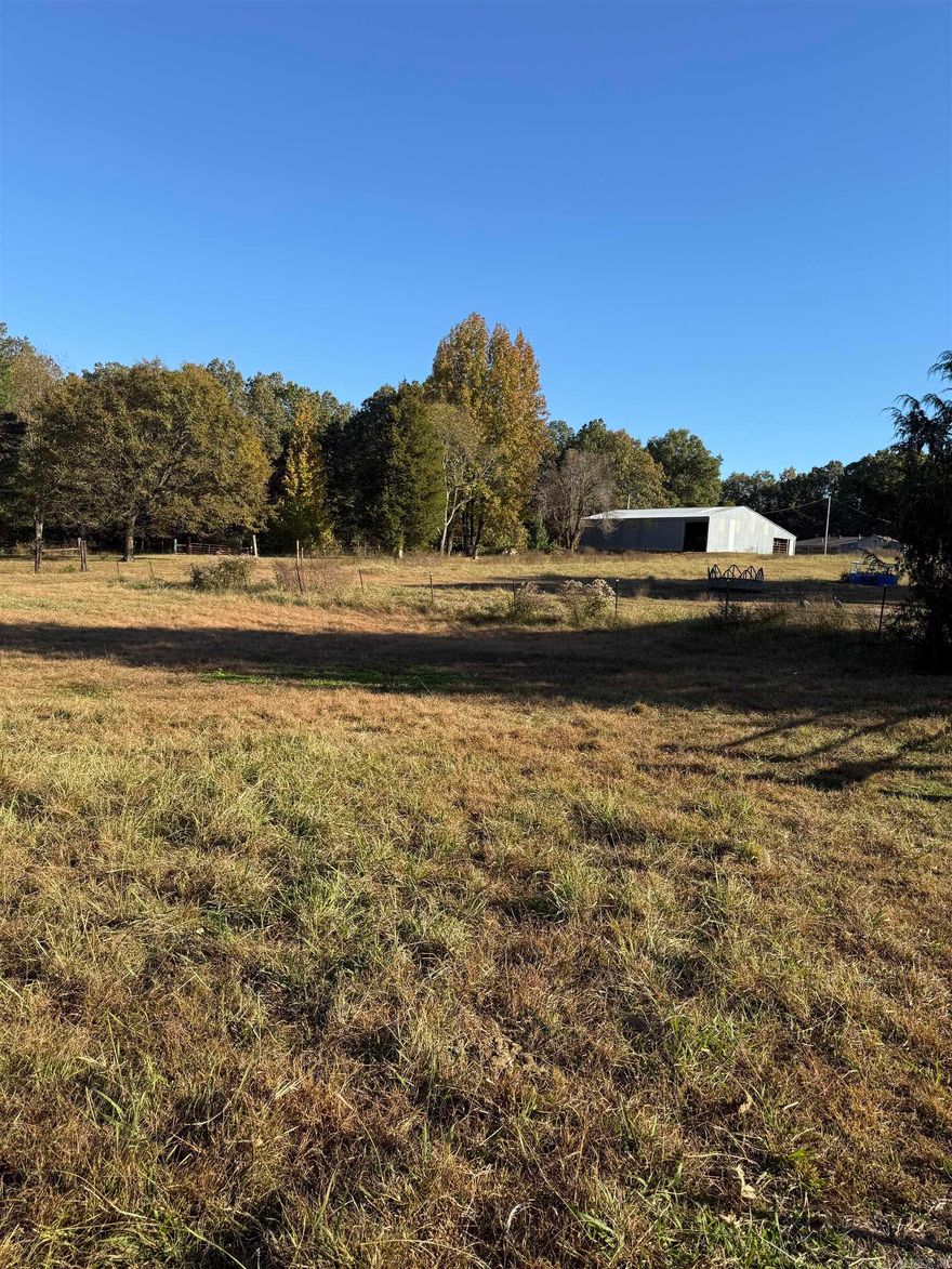 6.5 acres m/l  also feature a large 60 x 60 ft. horse barn complete with horse stall, open inside arena, and outside lean-to,  All acres are fenced.  Nice also for building a ranch home,  Pasture land with tree line following side of fence.  Many new homes have been build on near road for sale by builder.. These acres are secluded.