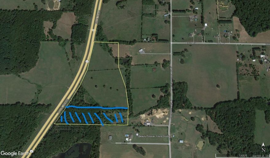 21 acres of mostly pasture. Fronts on Vilonia Bypass. Water and Elec. has access from Cypress Valley Rd. Buyer responsible for running water and Elec. from Cypress Valley Rd. Exact amount of acreage and legal to be determined by survey. Vilonia schools. The BLUE part on picture is not included.