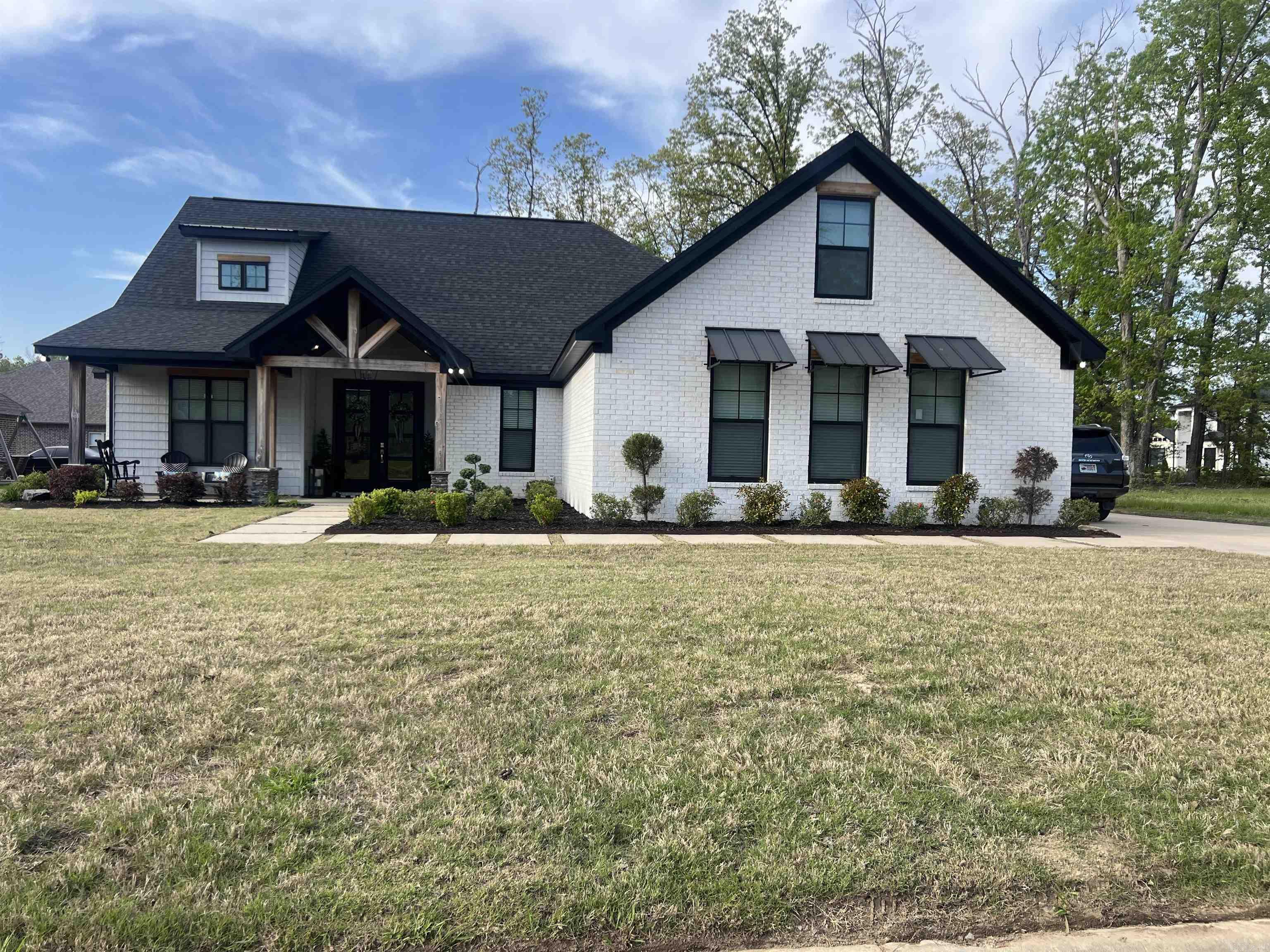 his beautifully custom-built home offers the perfect blend of luxury, functionality, and comfort. Featuring three spacious bedrooms and three full bathrooms, this thoughtfully designed layout includes a heated and cooled bonus room upstairs, ideal for use as a 4th bedroom, gym, or theater room. The heart of the home is an open-concept kitchen, complete with a large island, coffee bar, and an eat-in area, perfect for casual dining and entertaining. A walk-in pantry provides ample storage, while the large mudroom just off the garage it offers practical organization space. A separate laundry room and a full bath is just off the mudroom adding convenience for busy households. The master suite is a true retreat, featuring a cozy fireplace, generous layout, and a spa-like master bath with double sinks, a tiled shower with rain head, and a garden tub for ultimate relaxation. Like the primary, another one of the bedrooms has direct access to the back patio, creating a seamless indoor-outdoor lifestyle. The covered back patio is an entertainerās dream, complete with a fireplace, mounted TV, and plenty of space for gatherings. The fenced-in backyard is beautifully landscaped, and private.