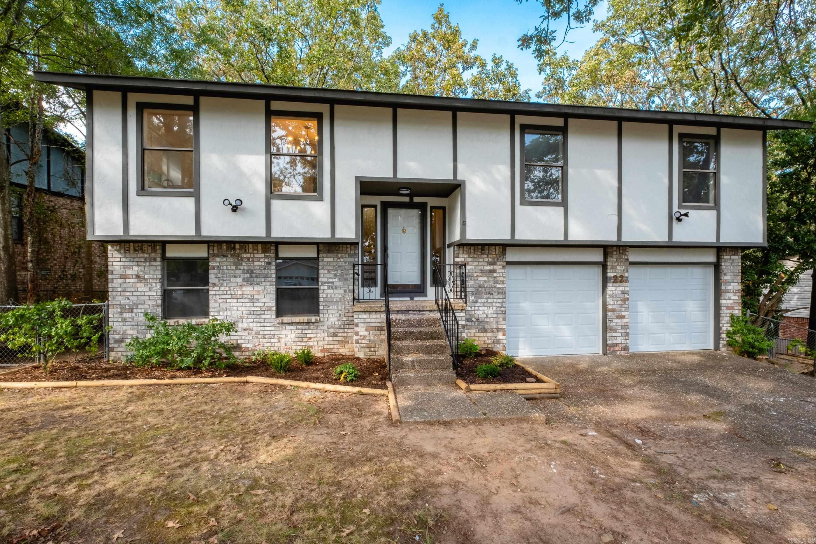 This beautifully remodeled home features a split plant, with 3 bedrooms and 2 updated bathrooms on the main level, plus an additional bedroom, bonus room, and full bath on the lower level. The interior showcases a modern design with a brand-new kitchen featuring quartz countertops, new flooring, updated lighting, tiled showers, a new water heater, and new garage doors with motors. Step outside to a spacious deck, perfect for relaxing and enjoying the sunset. Located in Sherwood in a well-maintained neighborhood with convenient access to shopping, dining, and major thoroughfares.