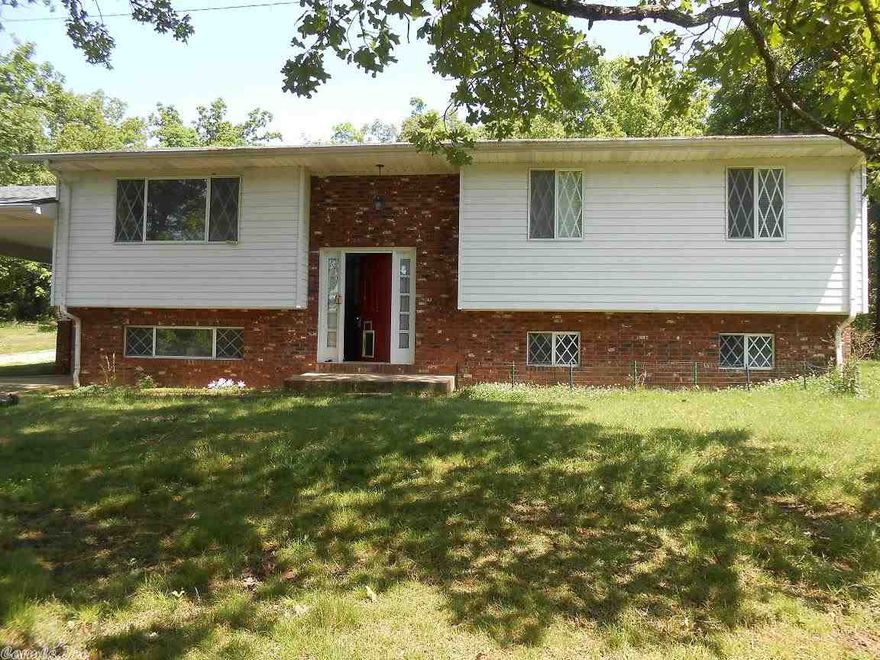 Spacious home, 3 bedroom 2 bath on 9.47 acres.  Brick & vinyl with attached carport.  Lower level partially finished with split foyer.  Great place to enjoy outdoor living and pond with privacy.  9.47 acres has been subdivided.
