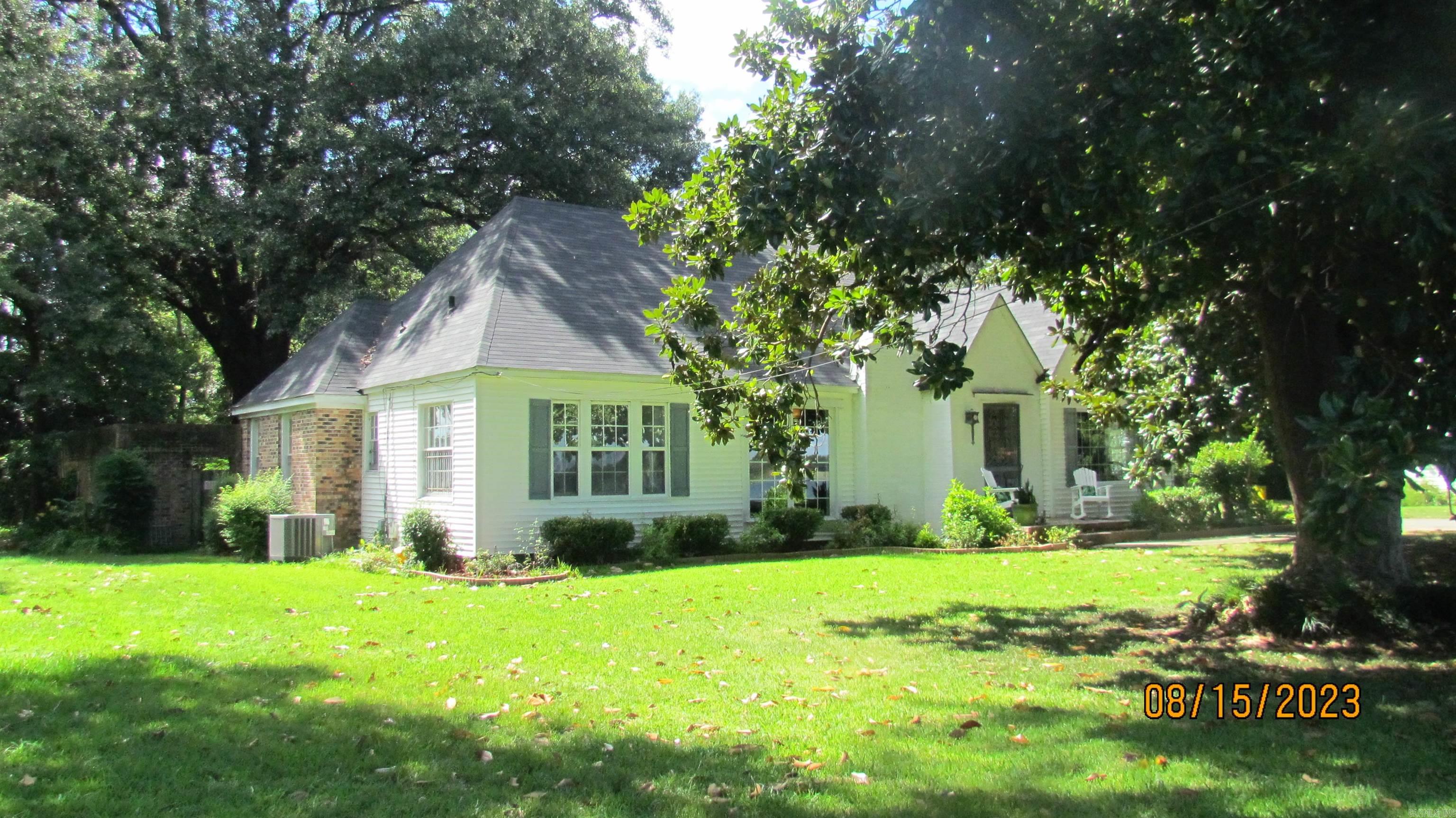 Located on beautiful Lake Chicot in Lake Village, AR with your own fishing pier and beautiful view of the lake, close to downtown, this lovely home features 3338 sq ft of living area with large living room with fireplace, formal dining room with beautiful windows and view of lake, four bedrooms, one could be sun room, Master suite, three full baths, two with showers over bathtub and one with walk-in shower, large laundry room with extra storage, kitchen with stove, dishwasher, refrigerator, new vent-a-hood large breakfast area, lots of cabinets, open to a very large den with second fireplace with gas starter, wet bar, French doors leading to porch and beautiful patio and beautiful backyard, landscaped with privacy fence, two storage buildings, two central units 4 years old, two hot water heaters, one a tank-less unit 2 years old, other gas hot water heater, both under warranty with Summit Gas, intercom system, fenced backyard, brick walkways/ patio, single garage and extra paring pad, Plantation blinds and some in attic if buyers wants them to remain, roof is one year old. No Swimming Pool. It has been filled in. Seller will provide home warranty.