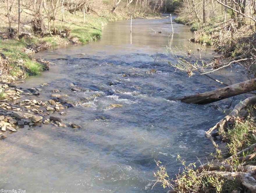 No. 01365 IZARD COUNTY RANCH FOR SALE ON MILL CREEK  This is an opportunity you don’t want to miss. The 64 acre ranch on Mill Creek, with over 900 feet of creek frontage, is mostly pasture currently home to several very happy longhorns. There is full perimeter fencing with county road access and a small amount of woods that offers excellent deer and turkey hunting.