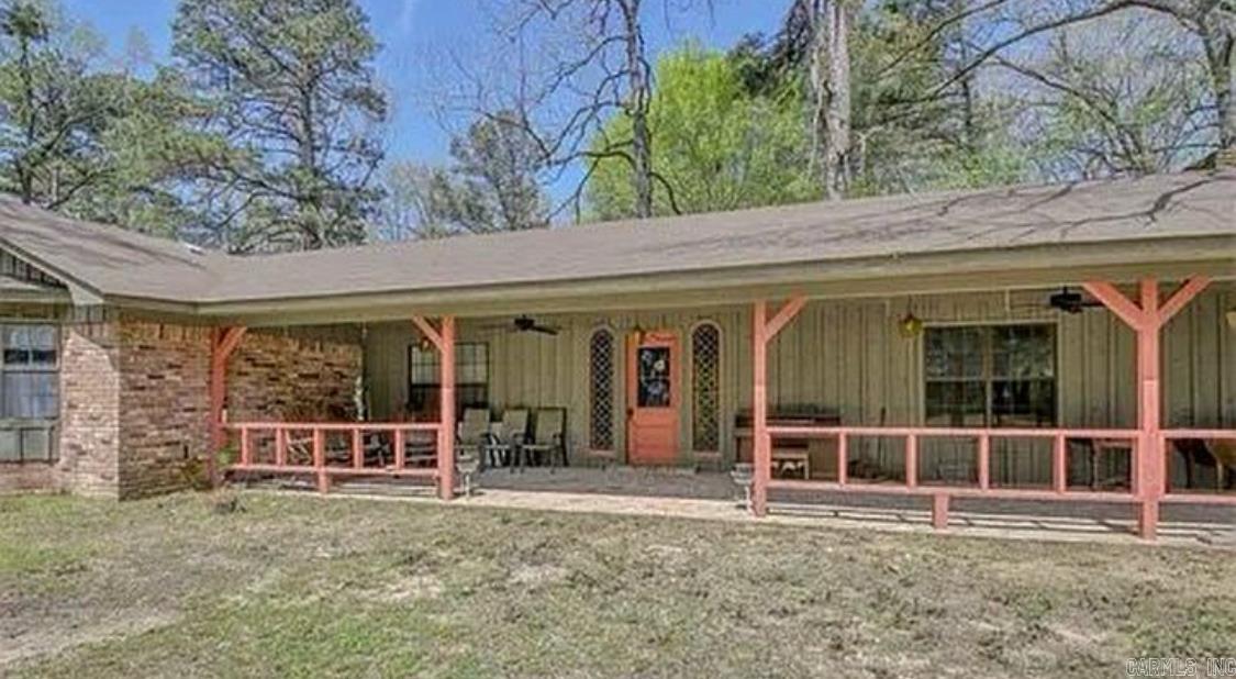 This Beautiflu Family Compound Nestled on a 5.2 acre lot with stunning mature trees, this recently renovated home is not one to miss!! Revel in modern appeal as the living and kitchen areas showcase a thoughtful remodel, offering a seamless blend of style and functionality. Kitchen has stainless steel appliances & a large island. Main house offers 2 living & dining areas along with 2 remodeled fireplaces. All new luxury vinyl plank flooring throughout home. Updates include new plumbing, new GFCI outlets, new roof, brand new HVAC unit, 3 new hot water heaters. Primary bedroom has direct backyard access. You also have an attached mother n law suite also recently renovated with its own private entrance, porch, bedroom, living room, kitchen, bathroom, & washer/dryer combo. This 727 sq ft apartment has its own covered parking area. In the back yard there is a detached in law suite that is perfect for a guest room or game room. This 699 sq ft apartment has its own bedroom, kitchen/living area, & bathroom, with private entrance. Outside guest quarters also include a 1025 sq ft workshop fully equipped with electricity/lighting. Two storage sheds offer additional storage as well.