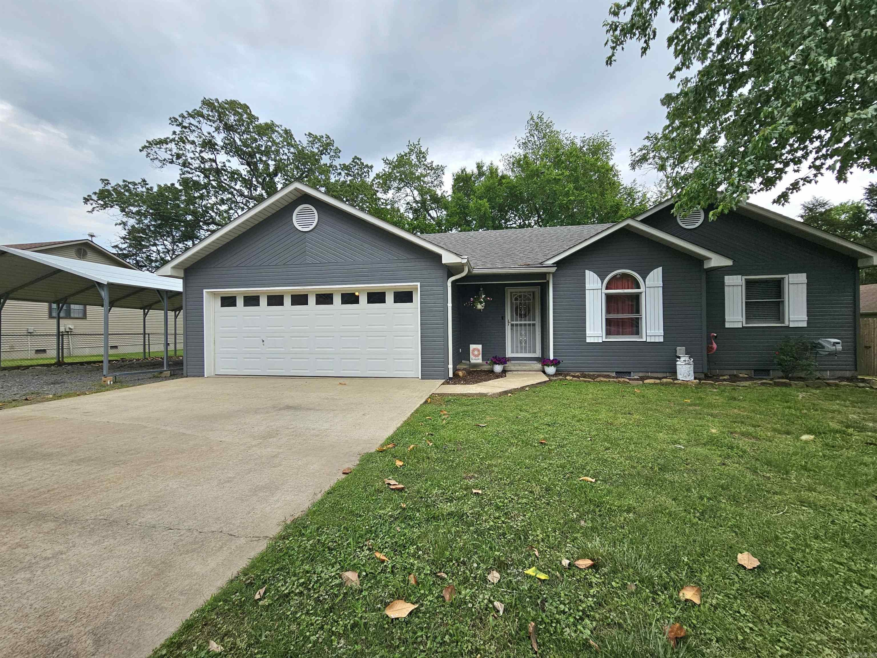 Charming 3 bedroom, 2 bath home with over 1,600 sq ft of living space and a bonus space perfect for hobbies or a home office! This property offers a fenced backyard, outdoor storage, a 2-car garage plus an additional carport—plenty of space for vehicles and toys. Located just 3-minutes from the Clinton School District, making it a convenient and cozy place to call home!