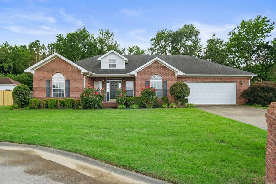 Seller is offering a paint allowance or rate buy down! Discover this charming 3-bedroom, 2-bathroom home nestled at the end of a quiet cul-de-sac in desirable west Searcy. Designed with both comfort and style in mind, this home features vaulted ceilings in the living area, elegant tray ceilings in the dining room and primary bedroom, and 9-foot ceilings throughout the main living spaces. The upgraded kitchen boasts stunning granite countertops and a sleek subway tile backsplash, creating a perfect space for culinary creativity. Both bathrooms are equally impressive, offering granite-topped vanities with twin vessel sinks. The spa-like primary suite features a luxurious stand-alone soaker tub with a custom surround and a cleverly "hidden" walk-in closet concealed behind a functional bookshelf. A standout feature of this home is the game/media room addition, located just off the living room and kitchen. Complete with screen and projection equipment that convey, this space is perfect for movie nights, gaming, or entertaining. This home’s thoughtful upgrades and unique details make it a must-see. Schedule your showing today and envision your future here!  Sq ft approx, please measure.