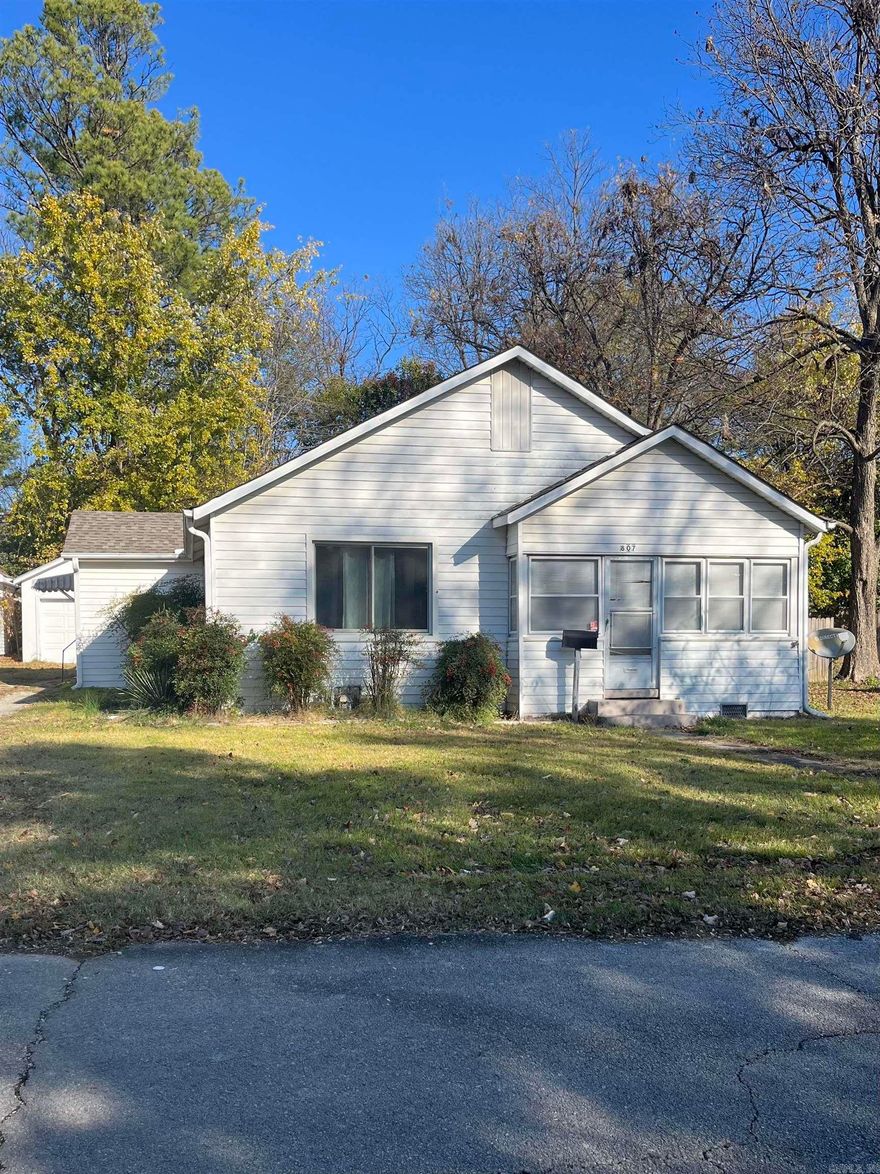 Come check out this charming new listing! Sitting in an established neighborhood, this homes location is sitting near the center of Paragould. It offers a fully fenced back yard and a beautiful sunroom off of the front of the home. There is a detached one car garage and an additional shop building in the back yard. A new roof was placed in 2023 and hot water heater is less than 1 year old. Schedule your appointment today! Do not miss your chance at making this property your next home!