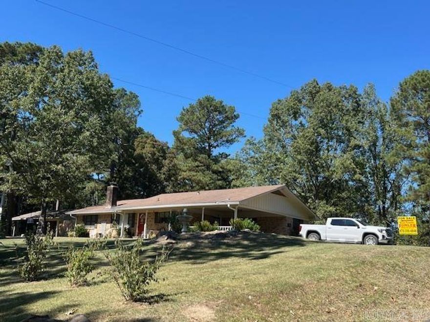 Close to Caddo River This all electric  home measures 1,545 +/- SF, 3 bedrooms, 2 baths with an eat in kitchen, dining /living area, attic w/pull down access in the carport, central H/A and wood burning fireplace with Ashley insert, wood laminate flooring throughout, 2 car attached carport,  all situated on a large 1+/- acre lot . City water and sewer,  detached 14x22 garage/shop with concrete floors & electricity. Nice size shed for mowers, ATVs, firewood and other storage is attached to shop. Visit: www.fowlerauctioneers.com for more details.