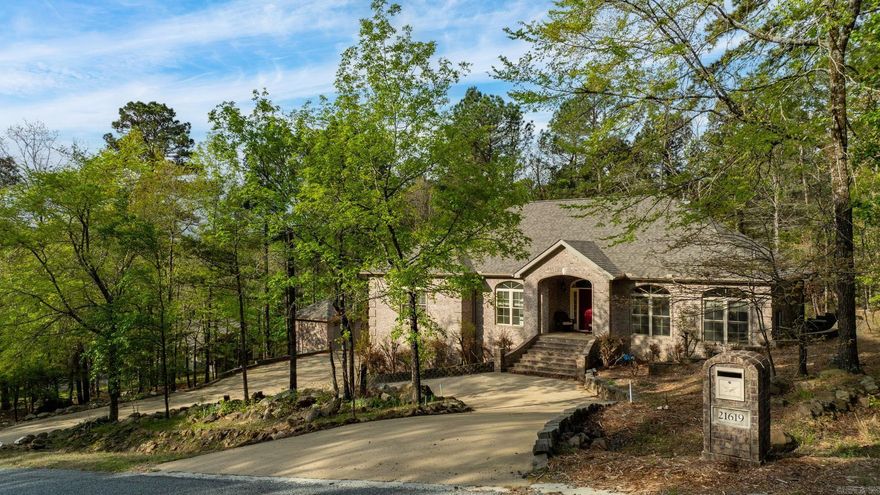 Exceptional custom-built brick home on 2 acres just steps from Pinnacle Mountain State Park! Fantastic floor plan with an open concept kitchen/dining/living combination. The great room is spacious with hardwood floors, tray ceilings, crown molding, and lots of natural light.  Granite countertops in kitchen with tile backsplash and maple cabinets with a breakfast bar and breakfast nook! This lives like a one level home with 3 bedrooms on the main level.  Handsome primary en-suite with lots of space.  Jacuzzi tub and walk in shower! Carpeted walk-in closet with a built-in dresser. Two bedrooms apart share a hall bath.  Bonus downstairs living with 2 bedrooms and another full bath. 3-car oversize garage with a workshop and shed. Double-paned windows throughout. French drain system. Woodburning fireplace with ceramic tile, raised hearth and blowers for living room and primary bedroom. New roof 2026! Great opportunity to own acreage near Pinnacle & Rattlesnake Ridge! See agent remarks!
