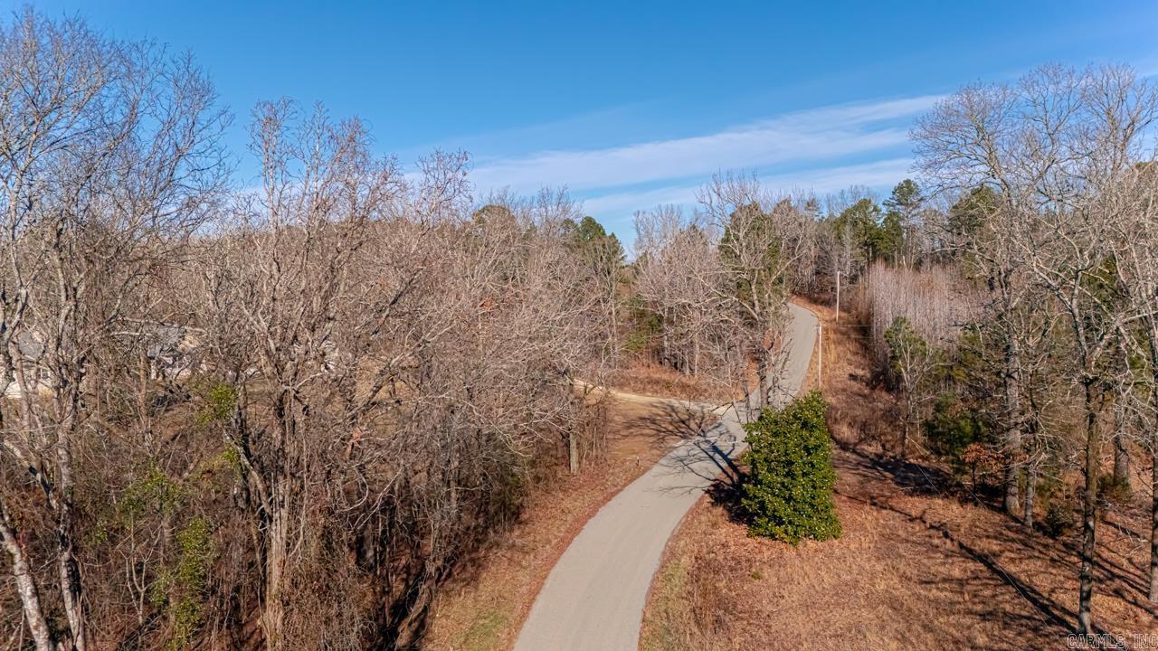Nestled in the heart of Hot Spring County, this 7.46-acre parcel offers a perfect balance of seclusion and convenience. Located just 6 minutes from Lake DeGray, a haven for fishing, boating, and outdoor recreation, this property is also 36 minutes from Oaklawn in Hot Springs and 17 minutes from Arkadelphia, making it ideal for both relaxation and commuting. The land is equipped with electricity and fiber optic internet, as well as public water access, with the added safety of a fire hydrant conveniently located at the corner. Whether you’re looking to build your dream home, start a small farm, or create a private retreat, this property offers endless potential. Don’t miss out on this beautiful opportunity to own land in a prime location!