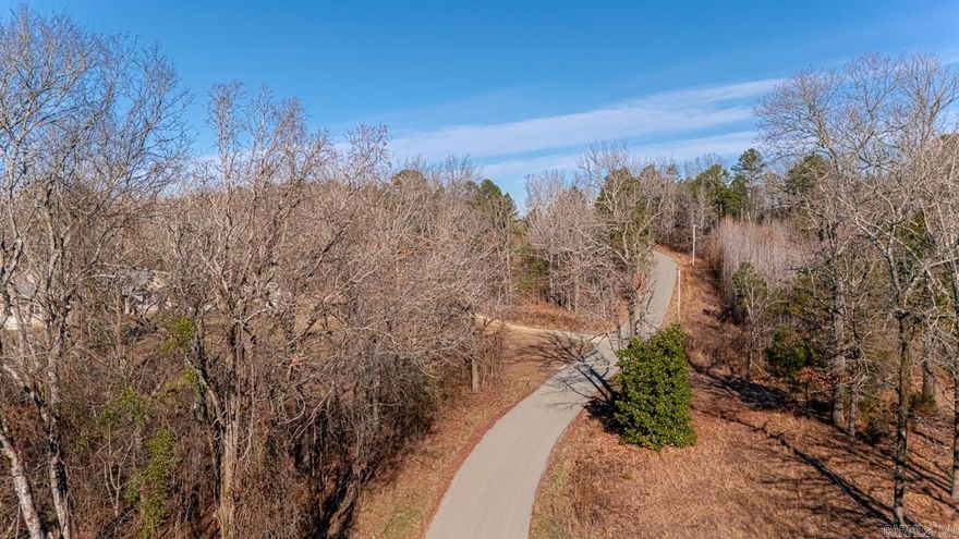 Nestled in the heart of Hot Spring County, this 7.46-acre parcel offers a perfect balance of seclusion and convenience. Located just 6 minutes from Lake DeGray, a haven for fishing, boating, and outdoor recreation, this property is also 36 minutes from Oaklawn in Hot Springs and 17 minutes from Arkadelphia, making it ideal for both relaxation and commuting. The land is equipped with electricity and fiber optic internet, as well as public water access, with the added safety of a fire hydrant conveniently located at the corner. Whether you’re looking to build your dream home, start a small farm, or create a private retreat, this property offers endless potential. Don’t miss out on this beautiful opportunity to own land in a prime location!