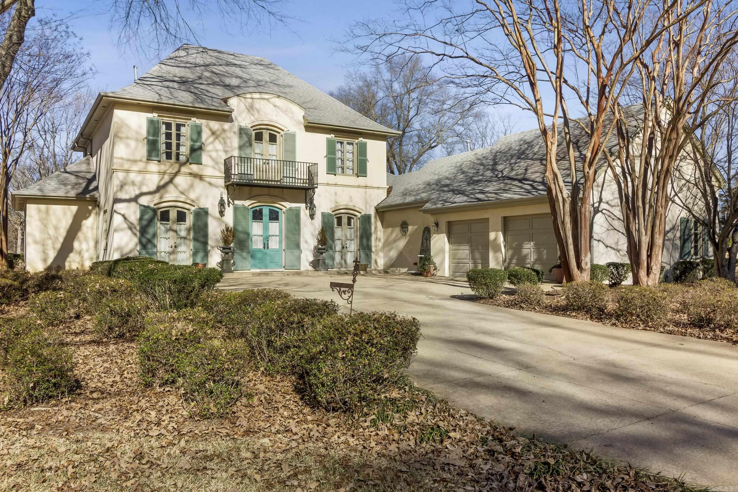 Elegant Country Club Living located on a large corner lot of the Searcy Country Club Golf Course. This exquisite custom-built French inspired residence offers a luxurious lifestyle in a highly sought-after location. Nestled on a sprawling 1.17-acre lot, this home boasts breathtaking views with 22 foot ceilings in the main living room and 10 foot ceilings throughout. This one of a kind home offers two living areas with hand built custom limestone fireplace in each of them. Spacious rooms with soaring ceilings and an abundance of natural light. A large kitchen featuring Jenn-Aire appliances, ample counter space, and a large island. A large luxurious master suite offers retreat to an oasis of tranquility with a spa-like bathroom with his/her dressing areas, separate walk in closets and a door to the private retreat of a French cafe courtyard in the back yard. Enjoy the serenity of your own private oasis with a large, private courtyard for entertaining. All wood doors,Marvin windows,and concrete stucco are added amenities. This unique home features a large office and a large sitting room on the upstairs landing.