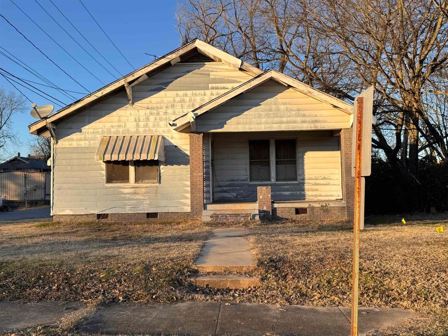 Investor Opportunity! Home on an oversized corner lot, requiring a full renovation but offering endless potential.   The property is being sold as-is, with no repairs to be made.  Proof of funds is required with all offers.