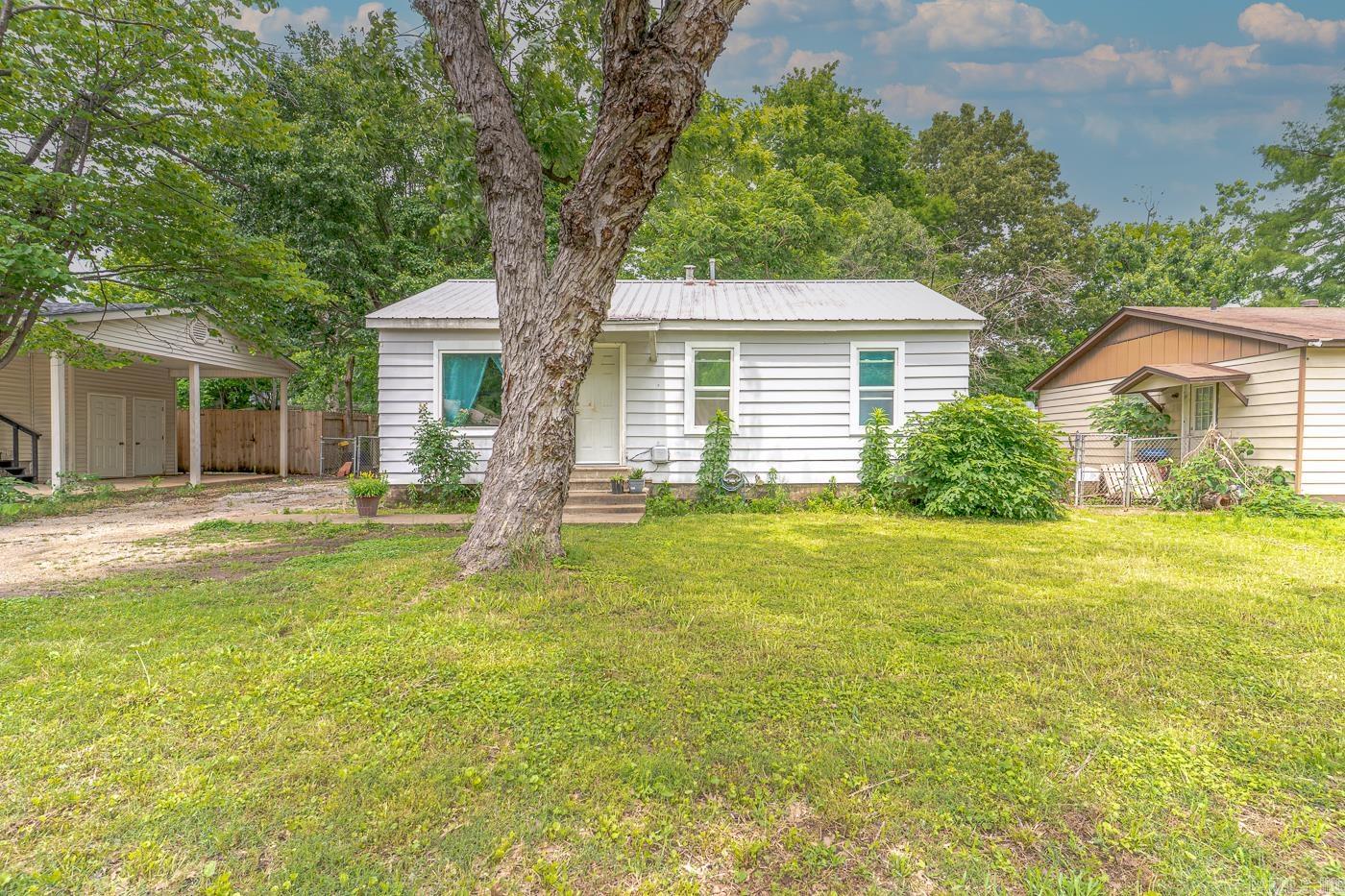 Welcome to Market 718 Owens Avenue of Jonesboro, Arkansas of the Medlins Subdivision within the Jonesboro School District. Situated on a .18 +/- acre fenced and level lot in the heart of town is a charming Ranchette style house that features 912 sf of well laid out living space that contains a large living room, dining room, kitchen with gas range and dishwasher, three bedrooms, bathroom with shower/tub combo, and laundry room. You'll love the updated windows, HVAC unit, vinyl flooring and more. Conveniently located near favorite local amenities. Call today to schedule your tour and make this house your home or next addition to your rental portfolio.
